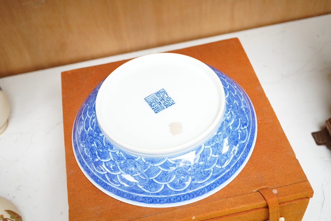 A Chinese blue and white ‘dragon’ dish in fitted box, 17cm diameter